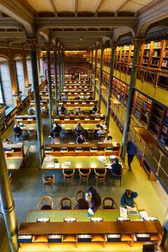 Stockholm, Sweden - February 15 2022: People read and study in the reading room in the Royal Library, also called the National Library of Sweden in Stockholm