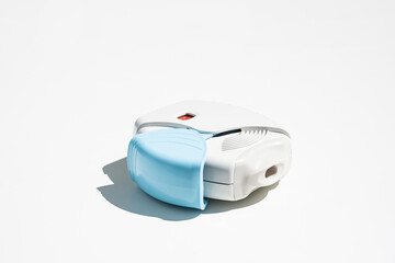 Asthma inhaler on white table. Aerosol for inhalation for treat lung inflammation and prevent...