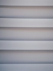 Fototapeta premium White textured striped background lit by natural light