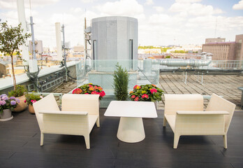 St. Petersburg, Russia, June 26, 2021, open, summer restaurant terrace without people, sunny day. Restaurant restrictions, pandemic. Light terrace furniture, modern restaurant interior