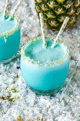 Jack Frost Christmas Cocktail with coconut rum, blue curacao, coconut cream and pineapple juice