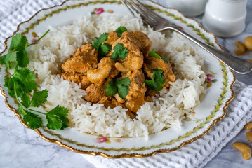 Chicken korma curry with cashew nuts and rice