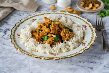 Chicken korma curry with cashew nuts and rice