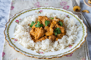 Chicken korma curry with cashew nuts and rice