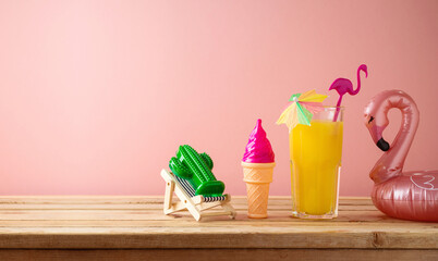 Retro aesthetic still life with orange juice, flamingo pool float and plastic toys, Summer vacation...