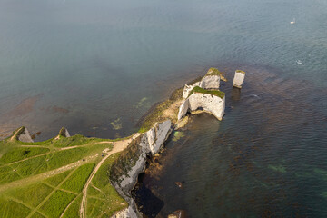 The drone aerial view of Old Harry Rocks. Old Harry Rocks are three chalk formations, including a stack and a stump, located at Handfast Point, on the Isle of Purbeck in Dorset, southern England.