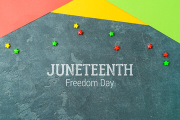 Fototapeta na wymiar Background for Juneteenth holiday day with colorful paper