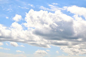 Naklejka na ściany i meble clouds like mountains against blue sky