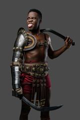 Fototapeta premium Photography of cheerful ancient gladiator of african ethnic showing his tongue.