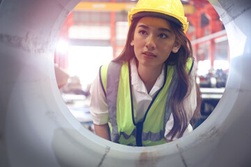 the lady worker or operator has operate the machine in production line factory, young woman check...