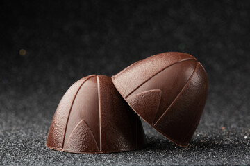 Chocolate bonbons closeup on a black background	