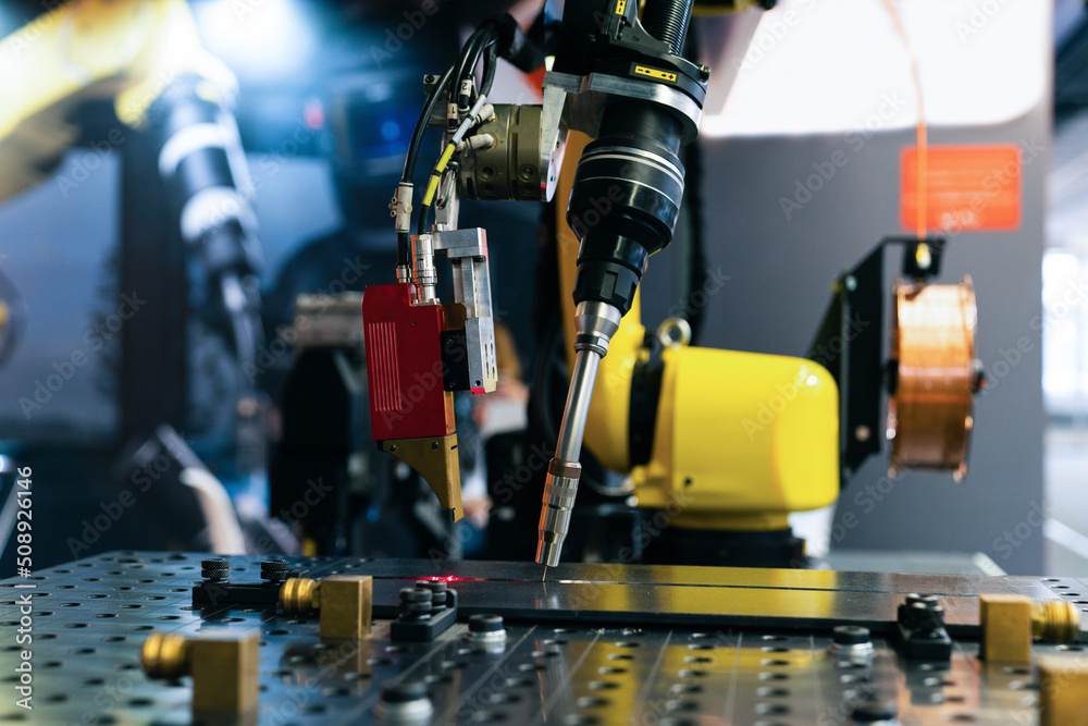 Aufkleber gas cutter on the robot arm.close-up of welding robot arm