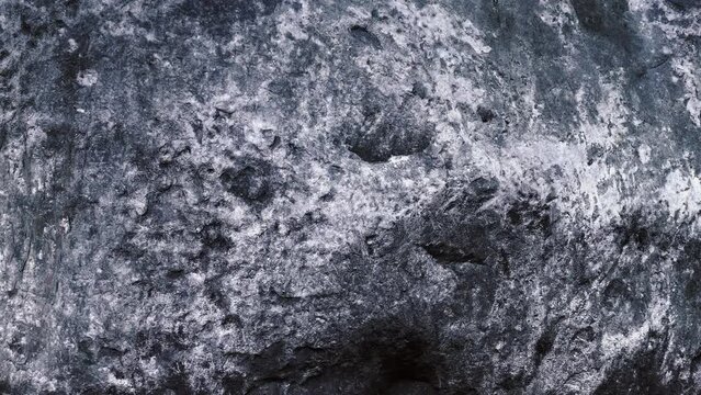 Close up on the texture of the stone in the park.