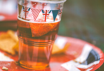 Bunting Covered Beer Glass And Plate - obrazy, fototapety, plakaty
