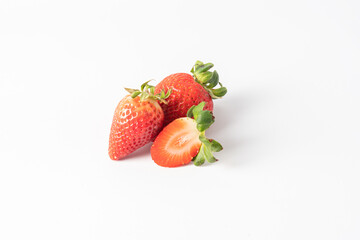 Strawberry fruit cut in half slice isolated on white background.