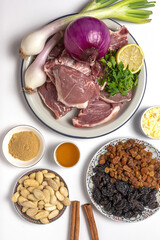 Raw ingredients and spices of traditional lamb stew or tagine