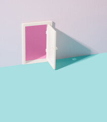 Open door presenting an opportunity revealing pink surface. Way out minimal background.