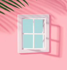 Pastel pink facade with white window and  palm casting a shadow. Summer vibe minimal background.