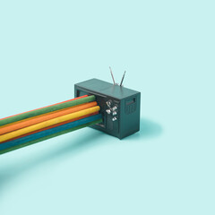 Retro TV set with colorful stick bursting through. Propaganda, fake news minimal concept.