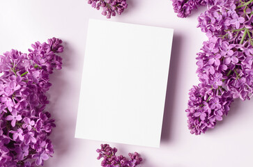 Invitation or greeting card mockup with spring lilac flowers