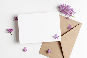 Blank wedding invitation card mockup with spring lilac flowers