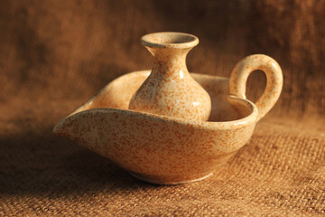 the jug on the wooden background