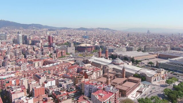 Barcelona, Spain: Aerial view of capital city of Catalonia, famous square Plaza Espa&ntilde;a (Pla&ccedil;a d'Espanya) and bullring Arenas de Barcelona, sunny day, blue sky - landscape panorama of Europe from above