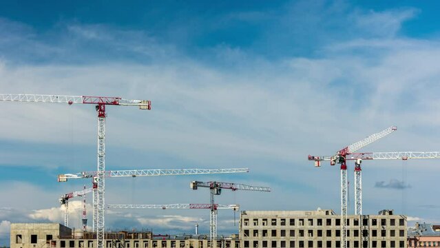 construction of a modern building, cranes at the construction site in the city