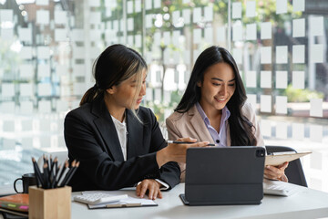 Asian business young people having business meeting discussing business ideas together colleagues brainstorm negotiate at briefing in boardroom, business meeting ideas and brainstorming