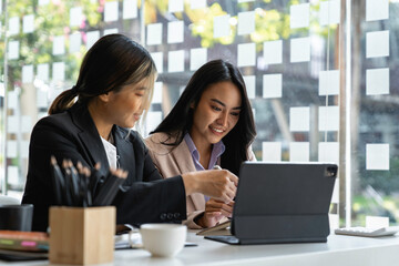 Asian business young people having business meeting discussing business ideas together colleagues brainstorm negotiate at briefing in boardroom, business meeting ideas and brainstorming