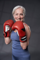 Senior woman taking boxing lessons