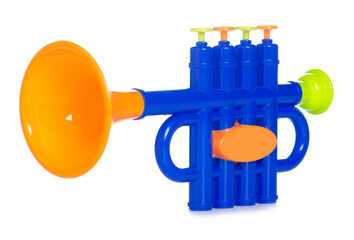 Kids toy musical instrument trumpet on white background isolation