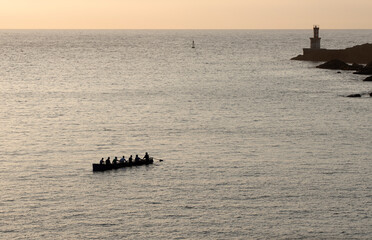 rowers in trawler training in the sea