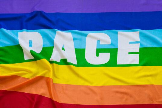 Gay flag with the word peace