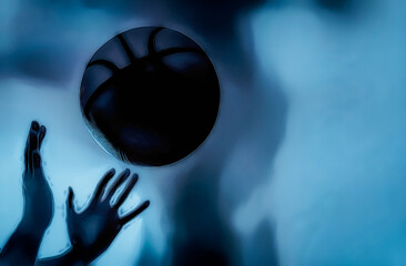 Throwing basketball. Silhouette. Copy space.