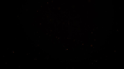 sparks like particles floating in air over black background