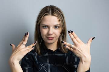 Beautiful teenager girl emotionally gesticulates