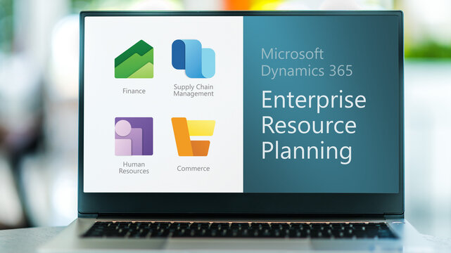 Laptop displaying icons of Microsoft Dynamics 365 ERP software