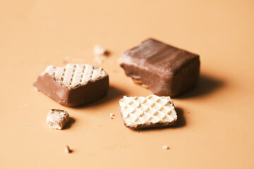 half eaten dark chocolate on a plate on table close up 