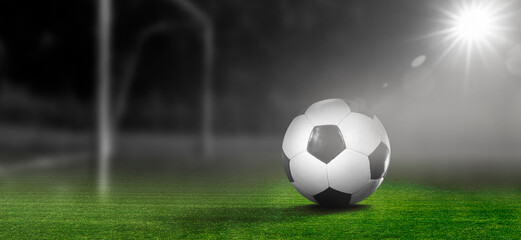 Fototapeta premium Soccer Fußball im Fußballstadion im Scheinwerferlicht