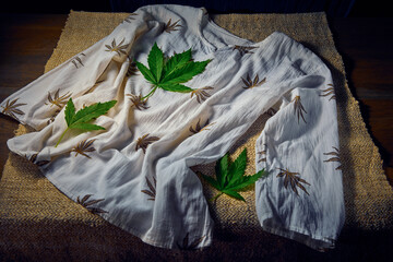 White cotton women's blouse with hemp leaf pater prints with natural canibas lives aand  hemp...