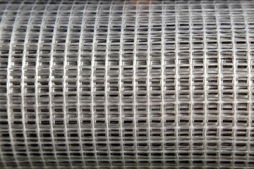 New gray fiberglass plastic splicing bars mesh reinforcement net. Building materials for concrete manufacturing.