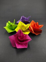 Paper roses in assorted colors isolated on black background, Not Focus