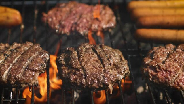 Mixed american barbecue food on hot grill