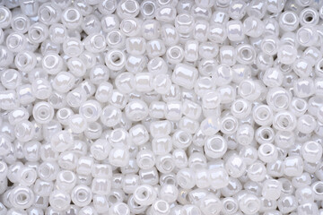 Beads. Seamless pattern with small decorative objects. Pile of pearl. Jewelry.