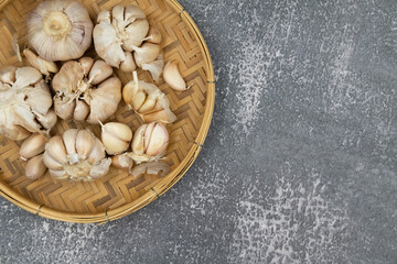 Fresh raw garlic on dark background for cooking concept set up