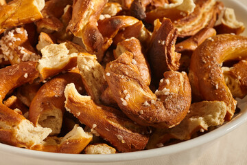 broken pieces of Pennsylvania Dutch handmade hard pretzels. The smaller pieces are considered...