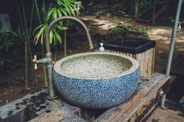 Fototapeta premium Vintage washbasin at the asian cafe garden