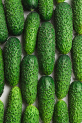 Fresh green cucombers as a background