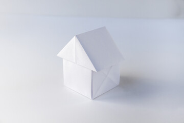 Paper house origami isolated on a white background
